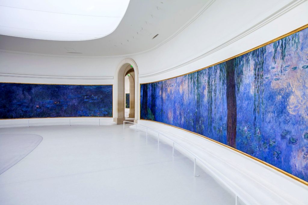 Monet's large-scale Water Lilies paintings wrapping around the oval gallery at Musée de l'Orangerie