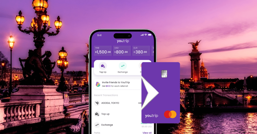 YouTrip app and card shown over a dusk view of Pont Alexandre III and the Seine