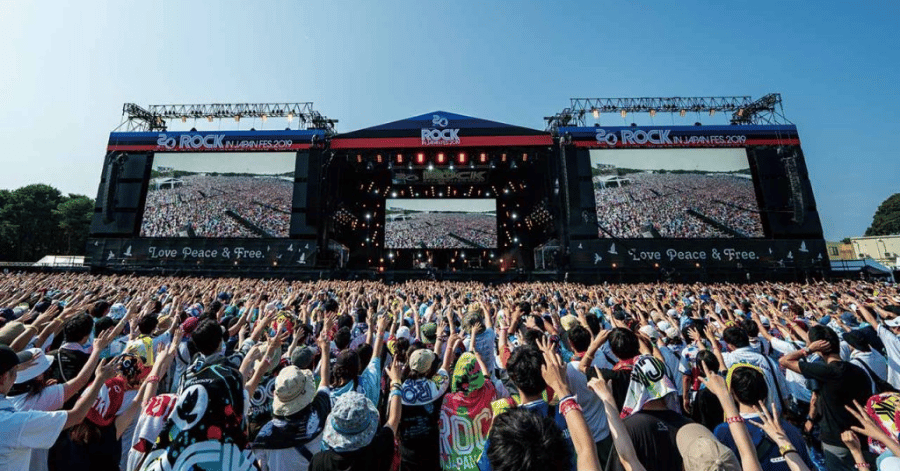 Huge crowd gathered before the main stage at an outdoor summer music festival in Japan