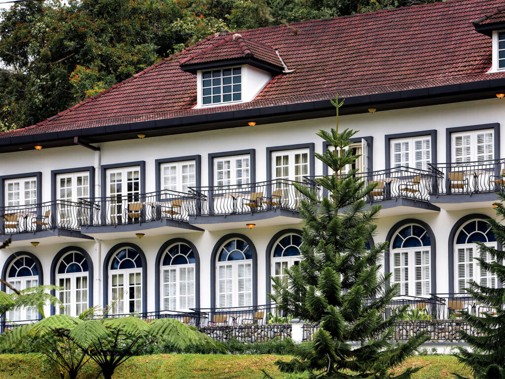 Colonial-style facade of Cameron Highlands Resort with arched windows and balconies