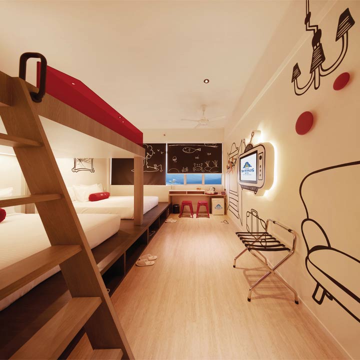 Family room with bunk bed and playful wall art at Genting SkyWorlds Hotel