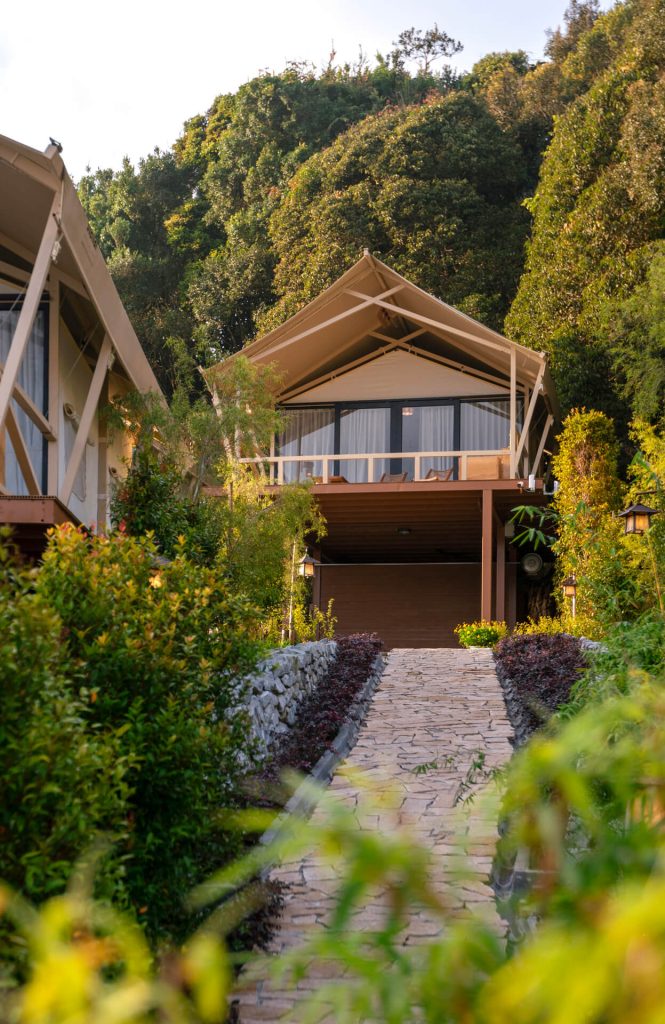Tented glamping villa with a balcony on a forested hillside at Zen by Stellar