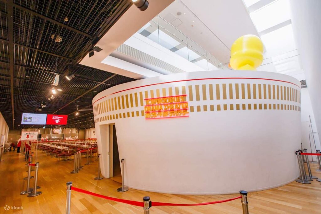 Interior of the museum showing the cup-shaped Cupnoodles Drama Theater and seating hall