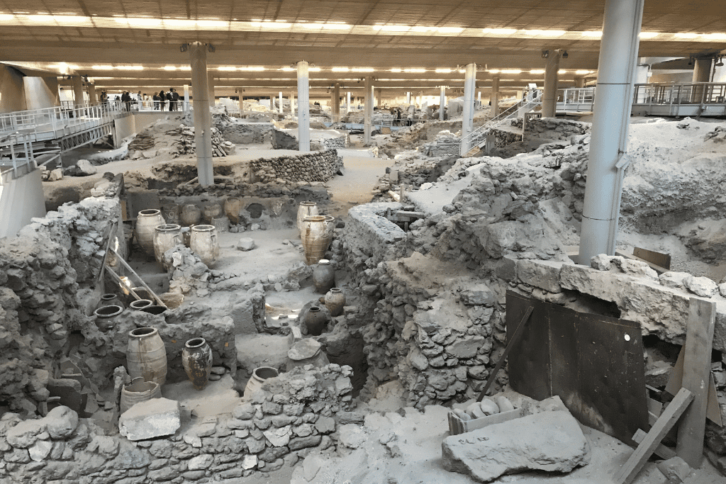 Excavated stone ruins of the Minoan town of Akrotiri under a protective roof, Santorini