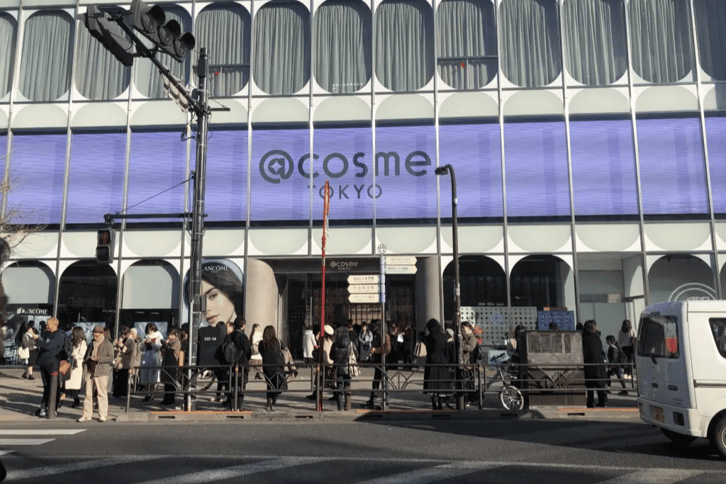 Crowds outside the @cosme TOKYO building entrance in Harajuku