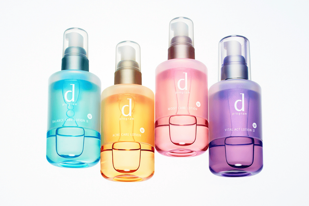 Four Shiseido D Program toner bottles in blue, gold, pink and purple