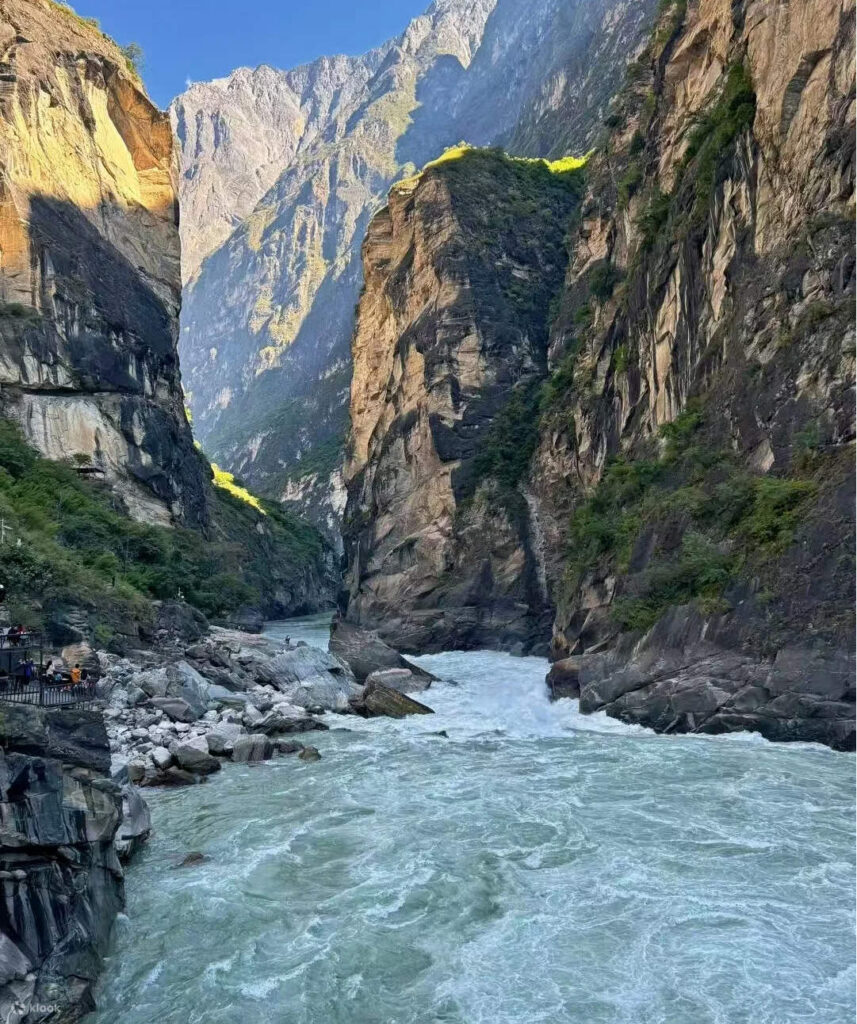 Turquoise Jinsha River rushing through the narrow sheer cliffs of Tiger Leaping Gorge