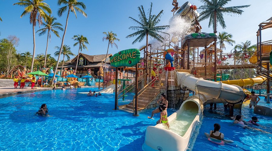 Children on water slides and in the pool at Aquatopia Water Park, Hon Thom