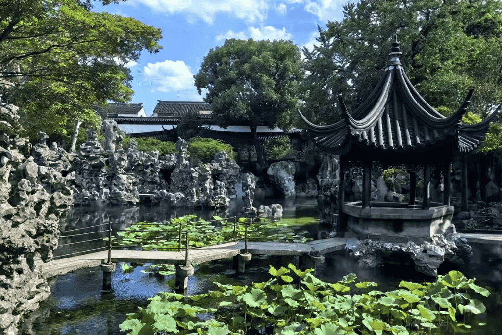 Limestone rockeries and a pavilion beside a lily pond in Lion Grove Garden