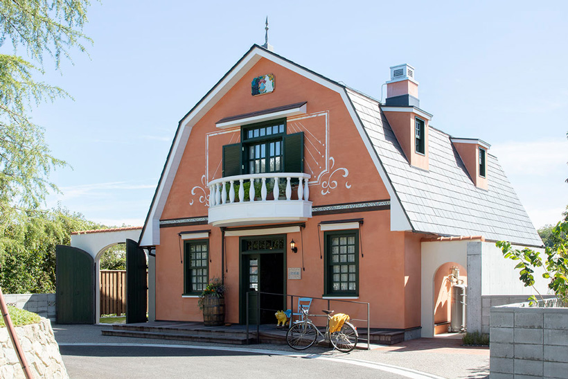 The terracotta World Emporium building, the antique shop from Whisper of the Heart, at Ghibli Park