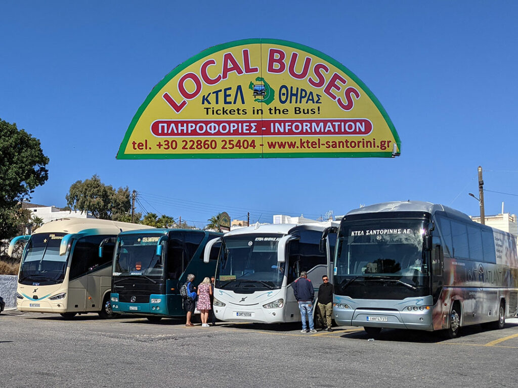 KTEL local buses parked under a Local Buses sign at Santorini's Fira station