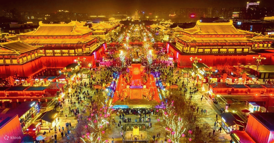 Aerial night view of the brightly lit Datang Everbright City pedestrian street