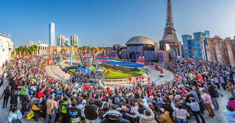 Crowds gathered before the Eiffel Tower replica at Window of the World theme park