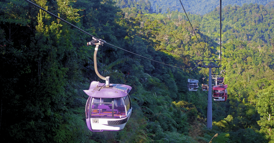 Awana Skyway cable car gondola gliding above forested slopes at Genting