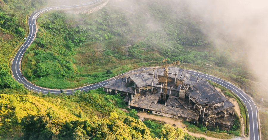 Aerial view of the Resorts World Genting complex on a misty forested ridge