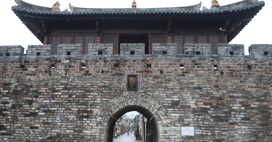 Stone archway gate in the ancient walls of Dapeng Fortress