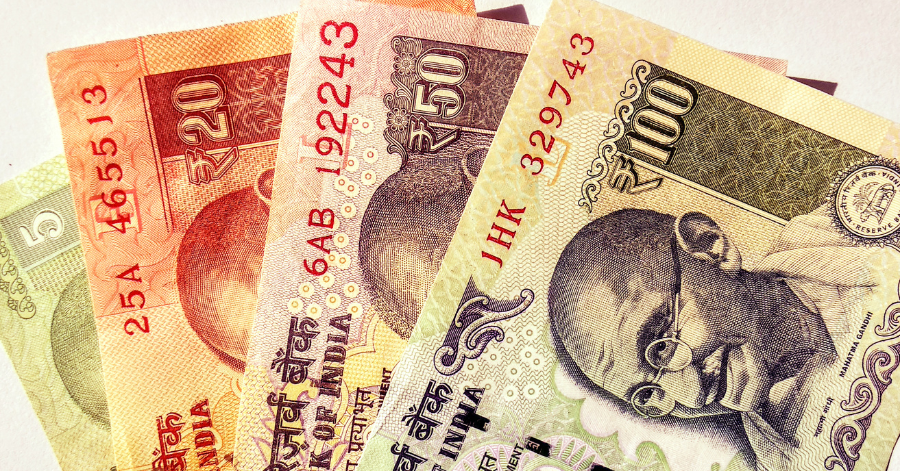Indian rupee banknotes in 20, 50 and 100 denominations fanned out