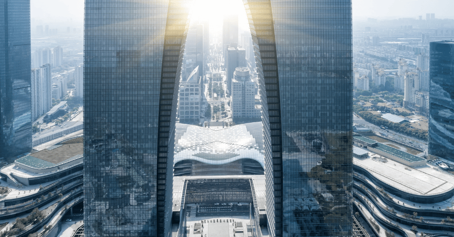 Aerial view of the twin-tower Gate of the Orient skyscraper catching the sun