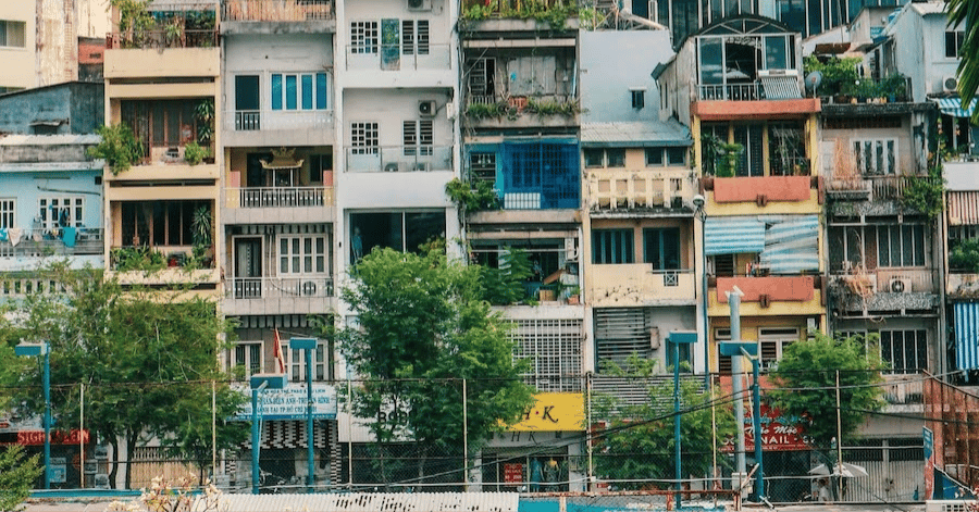Colourful old riverside apartment blocks along the Saigon River in Ho Chi Minh City