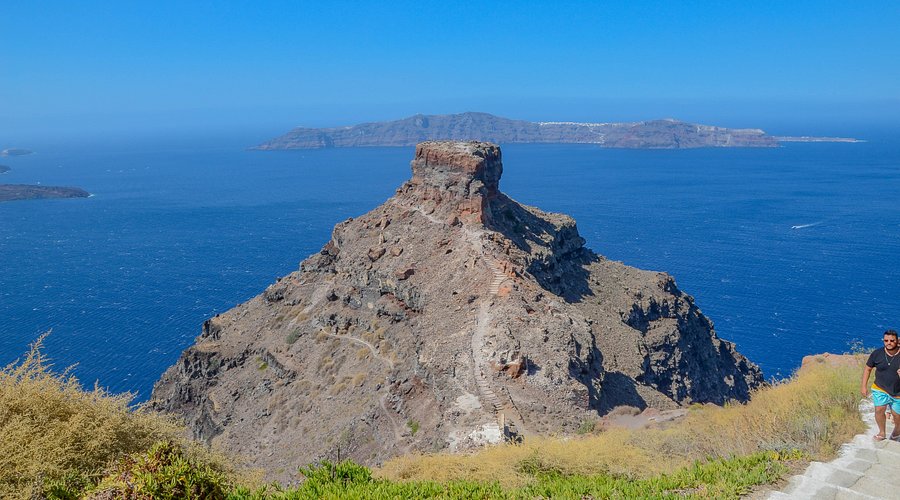 The rocky Skaros headland jutting into the sea below Imerovigli, with a trail leading up it