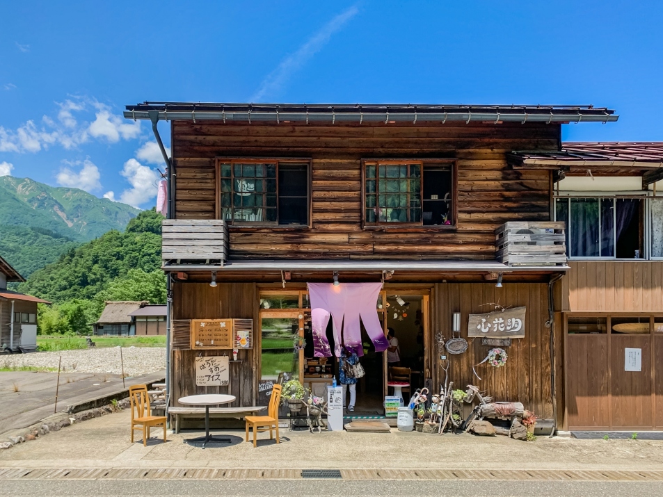 A traditional wooden shopfront selling ice cream and crafts on Ogimachi's main street