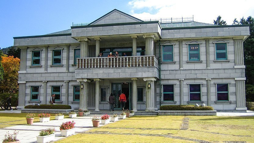 The grey stone Western-style Hakone Detached Palace building with columns and a balcony