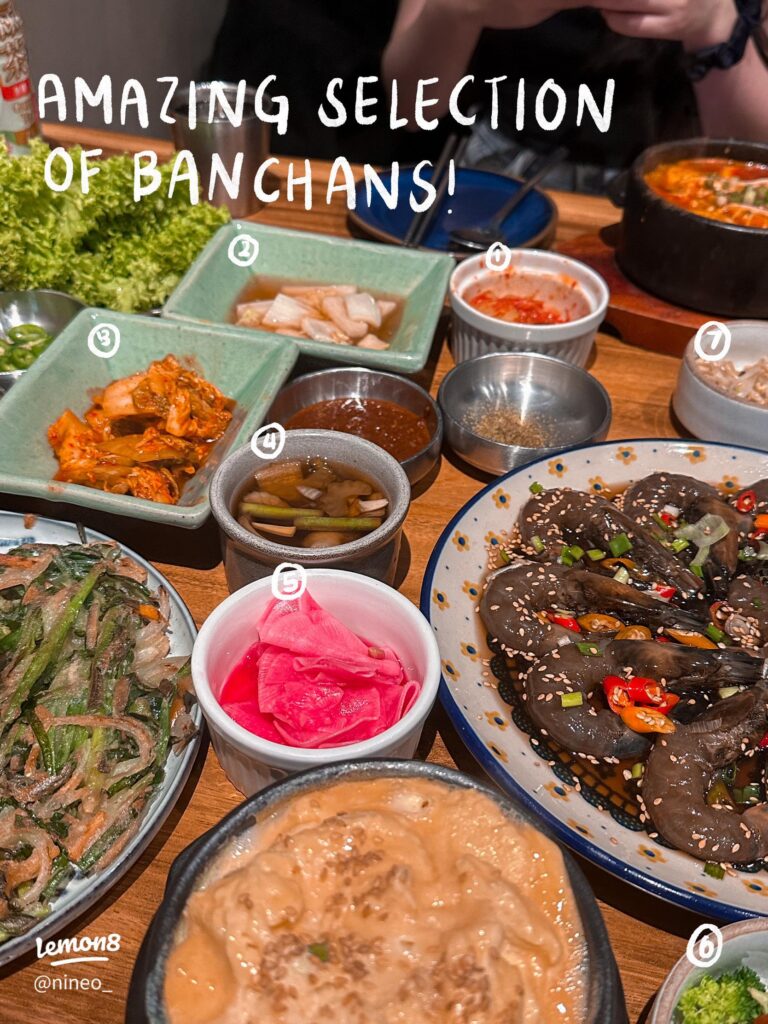 An array of Korean banchan side dishes at Doma, including kimchi, pickles and marinated prawns