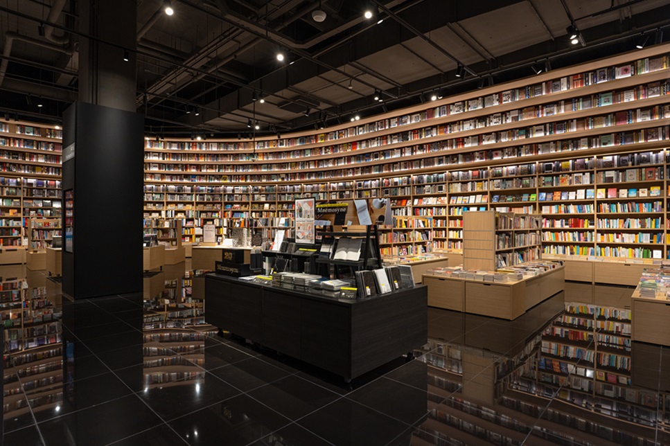 Interior of Tsutaya Bookstore with floor-to-ceiling curved bookshelves
