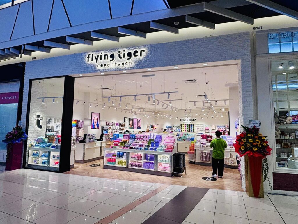 Flying Tiger Copenhagen storefront with colourful product displays inside the mall