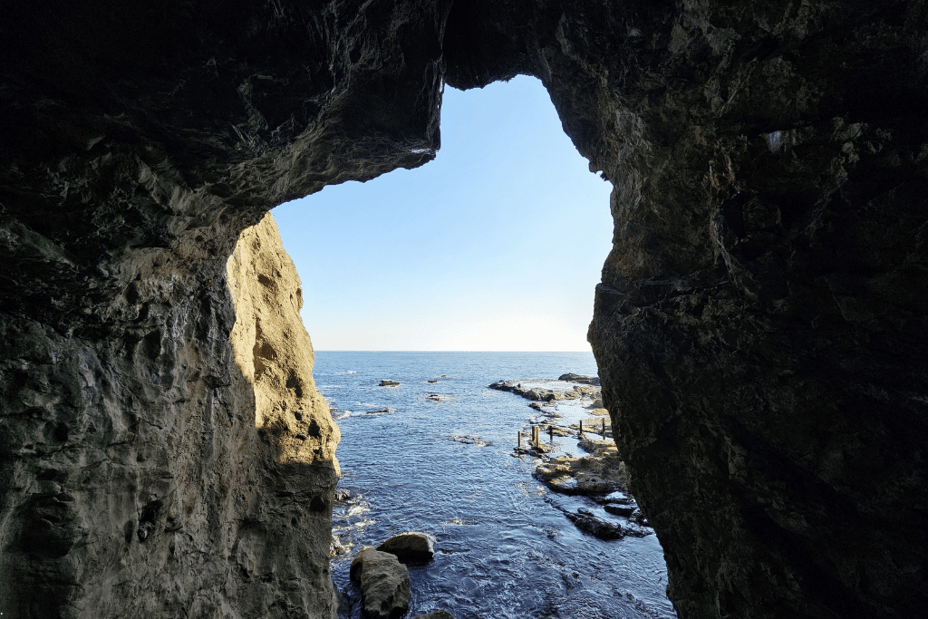 The sea framed by the rocky mouth of the Iwaya sea caves at Enoshima