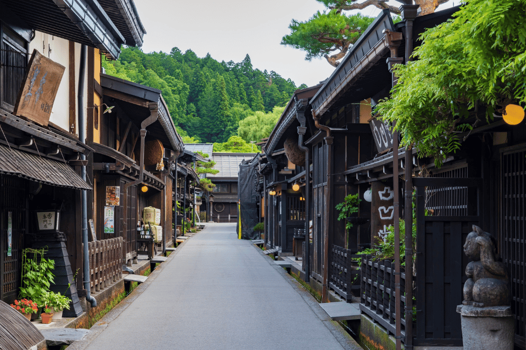 Dark-timber Edo-era merchant houses lining a narrow street in Takayama's old town