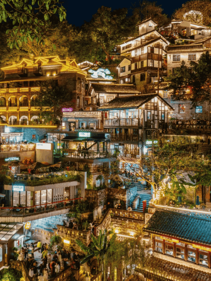 The stacked, glowing hillside lanes of Xiahaoli at night, Chongqing