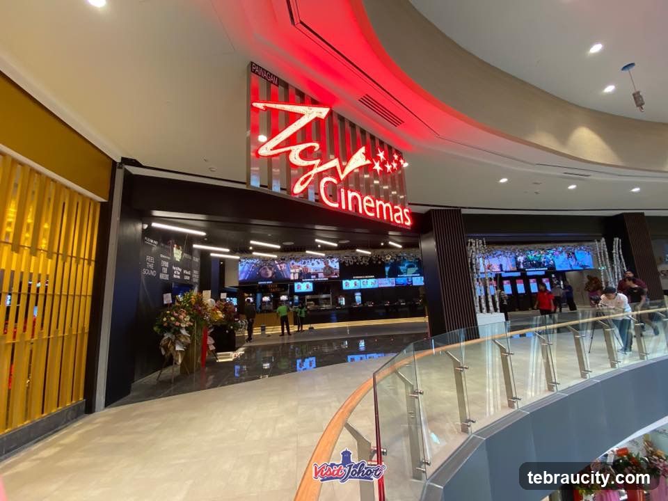 TGV Cinemas entrance with its red neon sign and ticket counter inside the mall