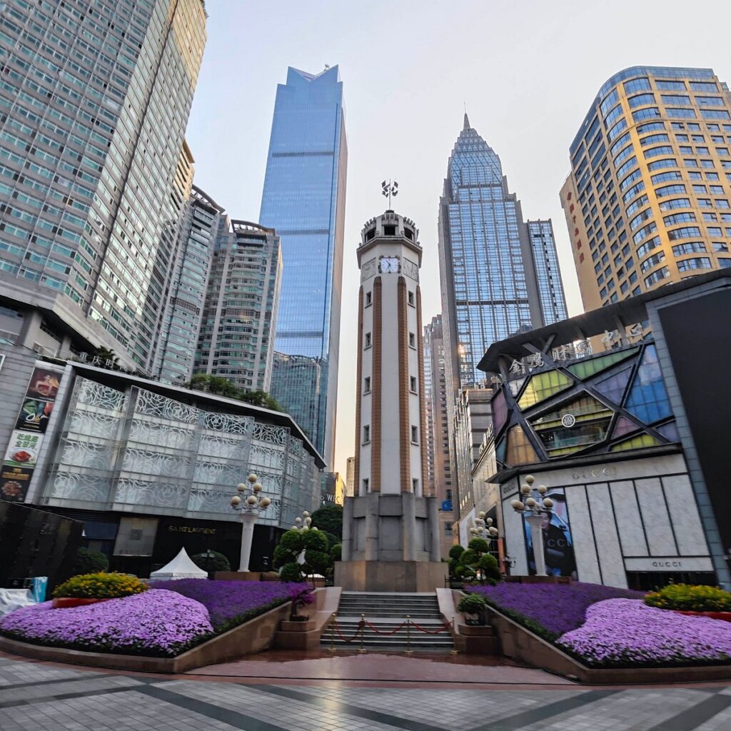 The People's Liberation Monument clock tower amid Jiefangbei's skyscrapers, Chongqing