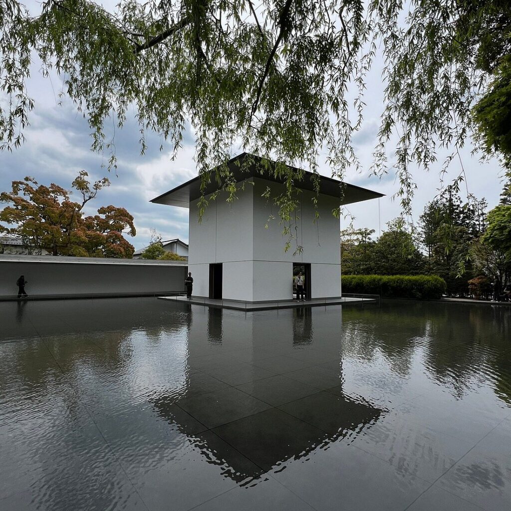 White Contemplative Space pavilion reflected in the Water Mirror Garden at the D.T. Suzuki Museum