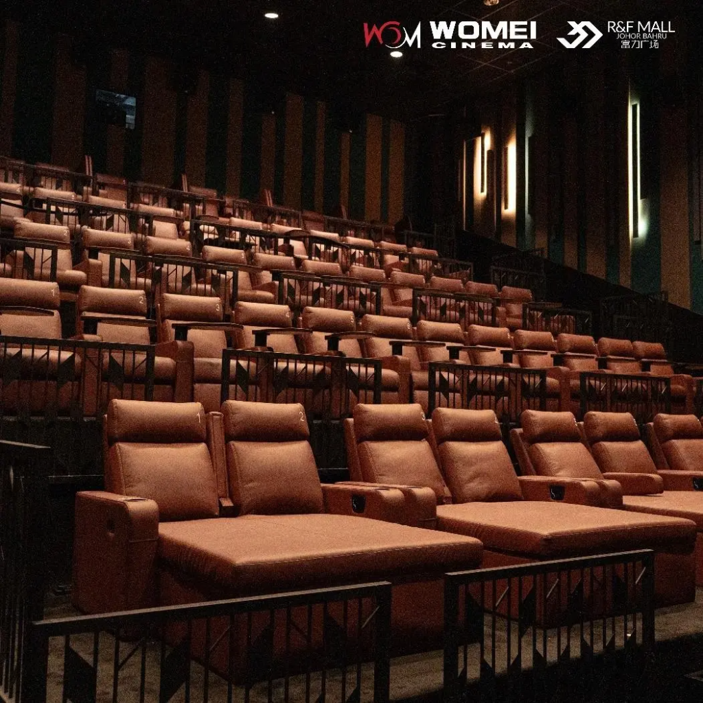 Empty auditorium at Womei Cineplex in R&F Mall, with rows of tan leather recliner seats