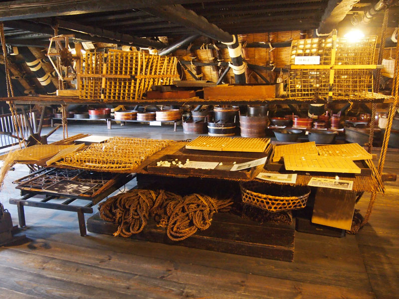 Traditional tools, baskets and rope displayed in the timber attic of a gassho-zukuri farmhouse