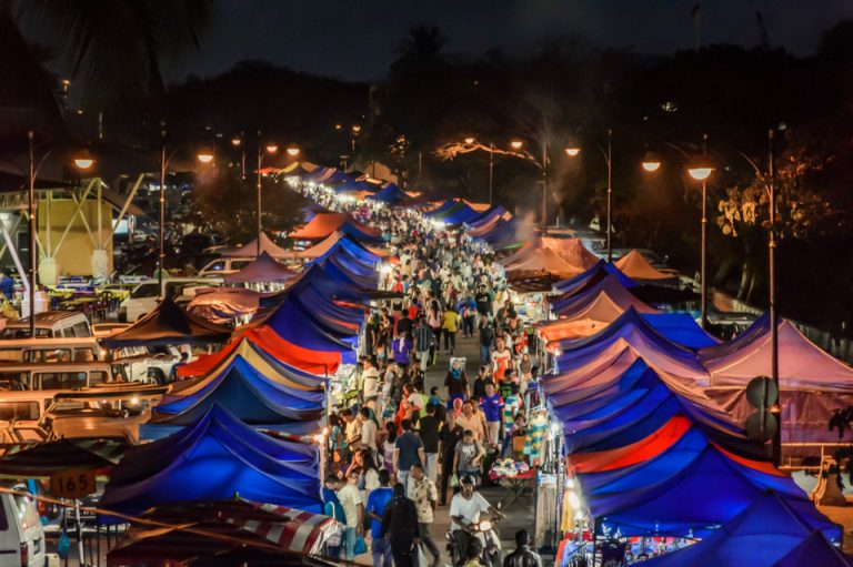 Crowds and colourful tents at a Langkawi night market after dark
