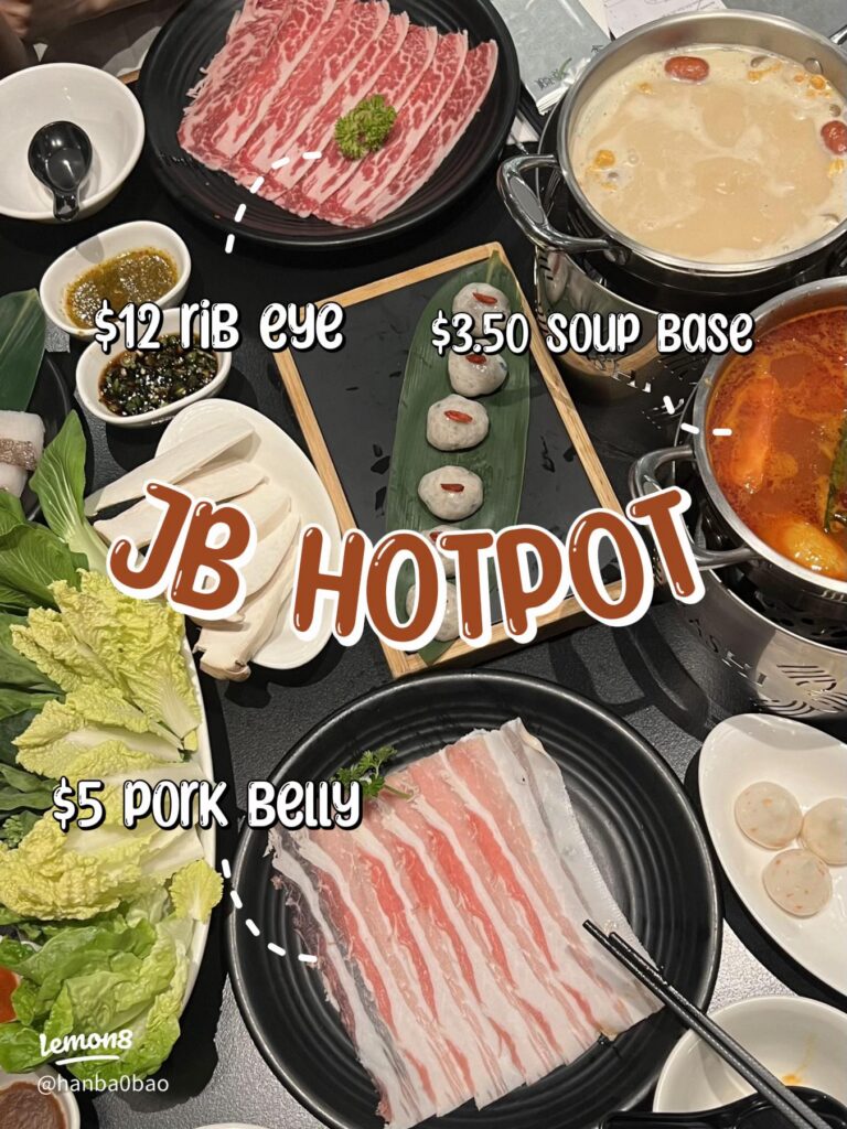 A shabu-shabu hotpot spread with marbled beef, pork belly, vegetables and twin broth pots