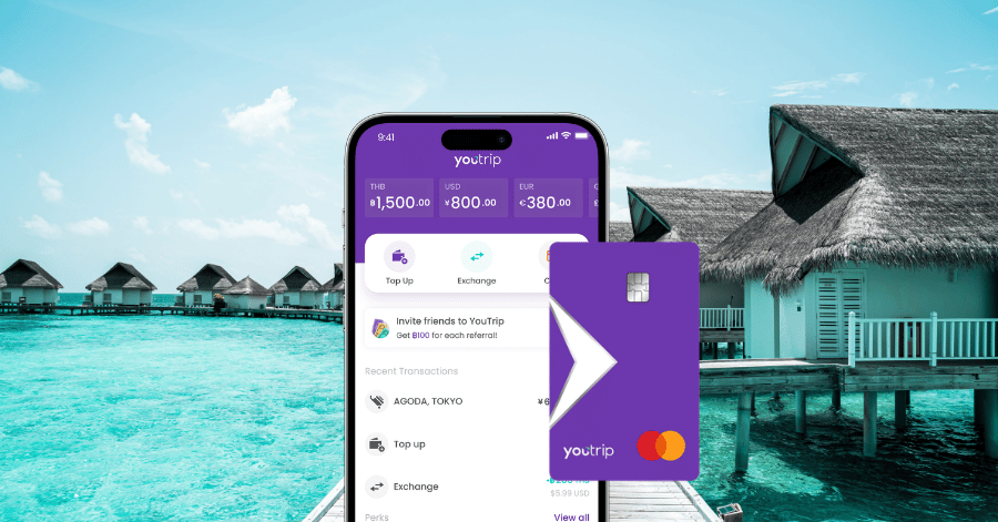 YouTrip app showing a multi-currency wallet and the purple YouTrip Mastercard, over a Maldives overwater-villa backdrop