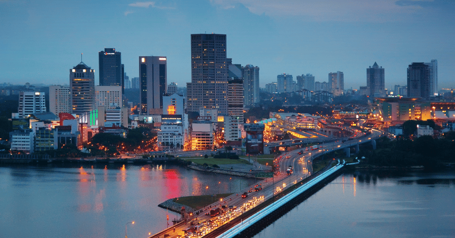 Johor Bahru city skyline and the Causeway at dusk, seen across the water
