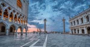 St Mark's Square in Venice at dusk, with the Doge's Palace and the columns of San Marco and San Todaro