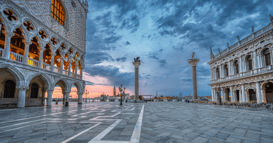 St Mark's Square in Venice at dusk, with the Doge's Palace and the columns of San Marco and San Todaro