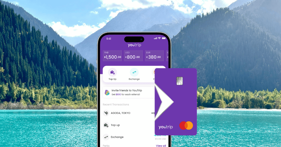 The YouTrip app and purple Mastercard shown against a Kazakh lake and forest