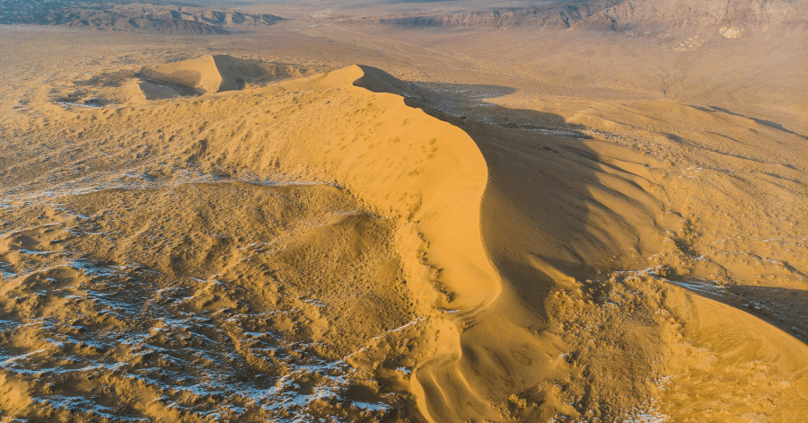Aerial view of the golden Singing Dune in Altyn-Emel National Park