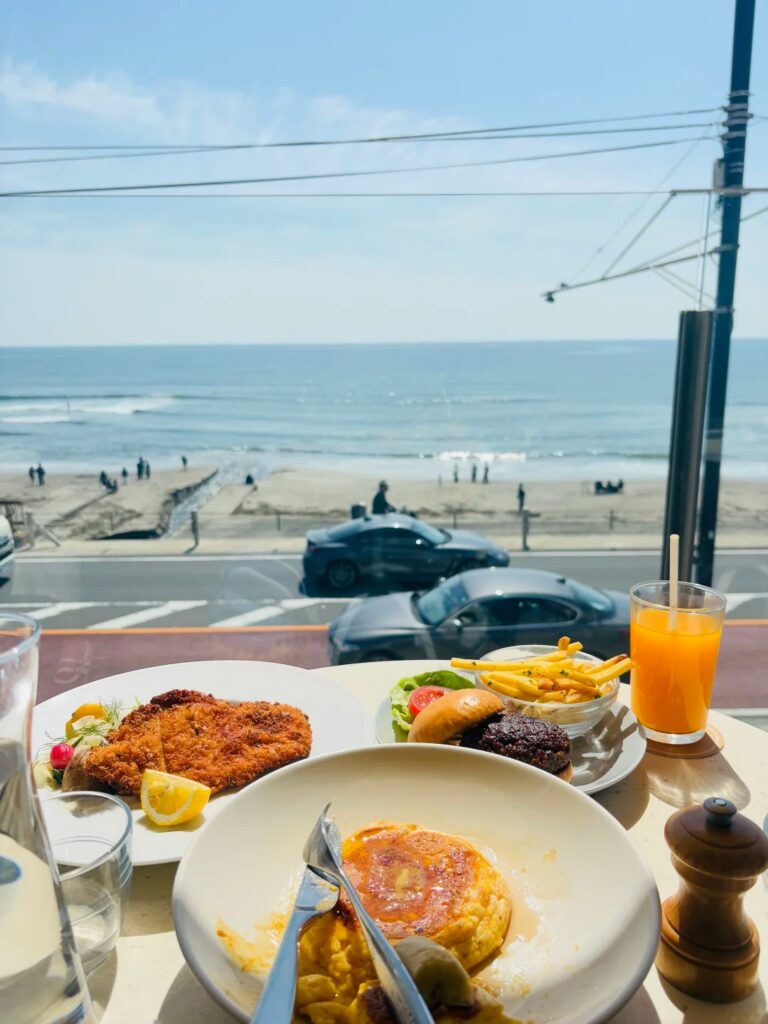 Brunch dishes on a table overlooking the beach at bills Shichirigahama, Kamakura
