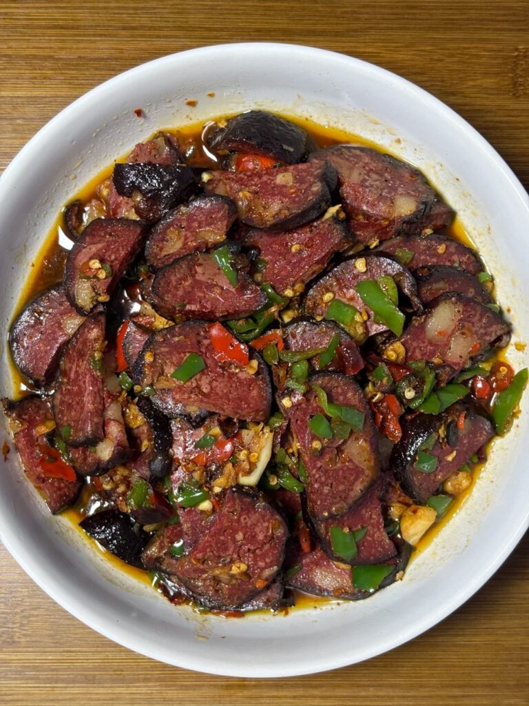 Sliced smoked blood tofu stir-fried with fresh green and red chillies
