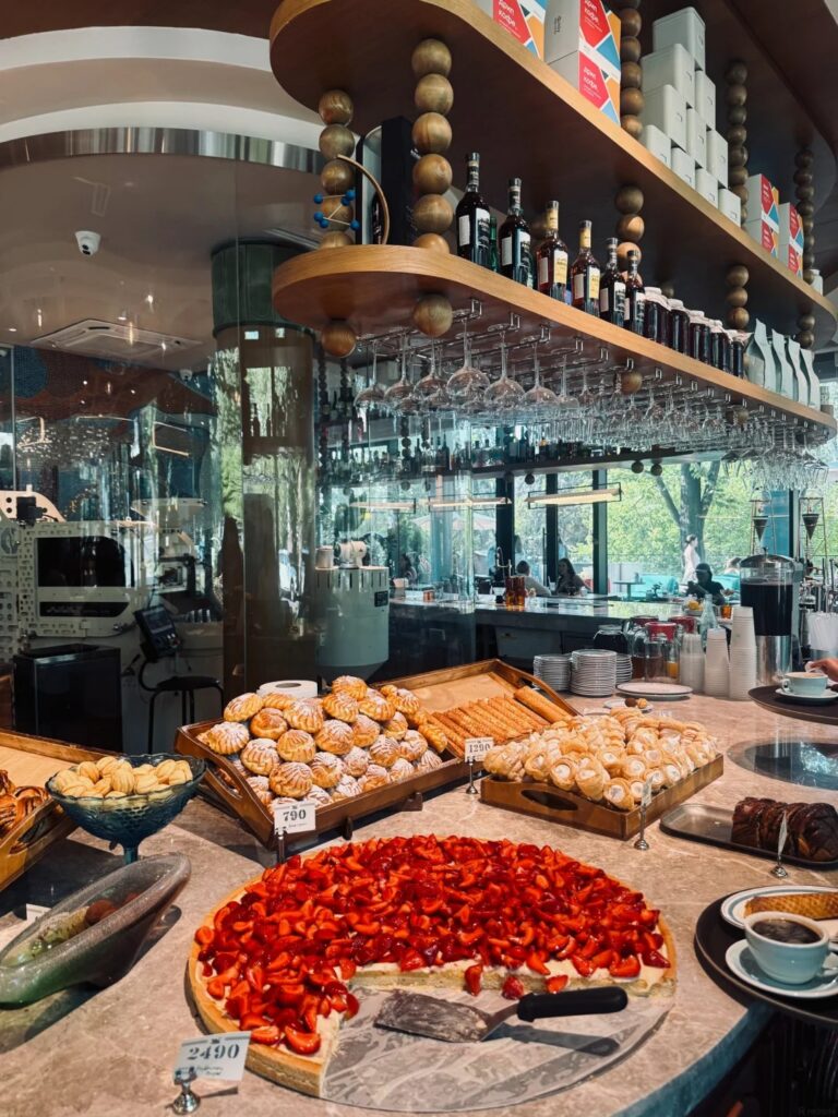 Cafe counter in Almaty laid with a strawberry tart and pastries