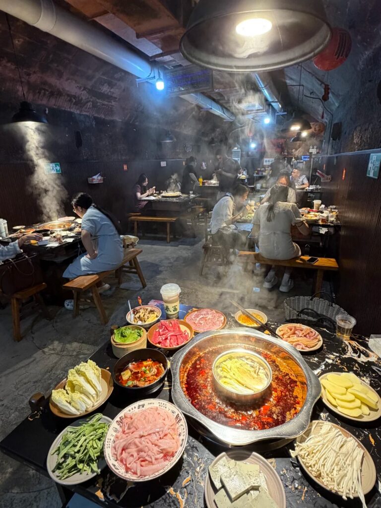 A mala hotpot spread in the underground WWII-shelter restaurant, Chongqing