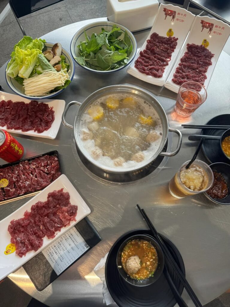Teochew beef hotpot at CMJ Kitchen: a clear broth pot with plates of thinly sliced raw beef and greens